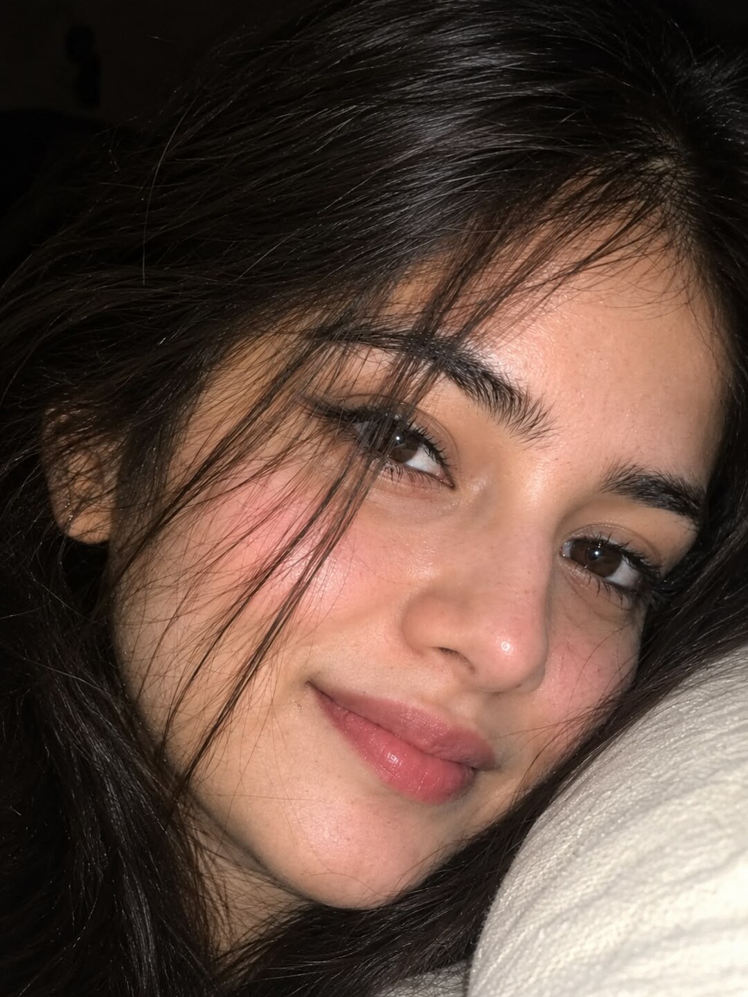 Night flash close-up portrait prompt result - candid face resting on a pillow